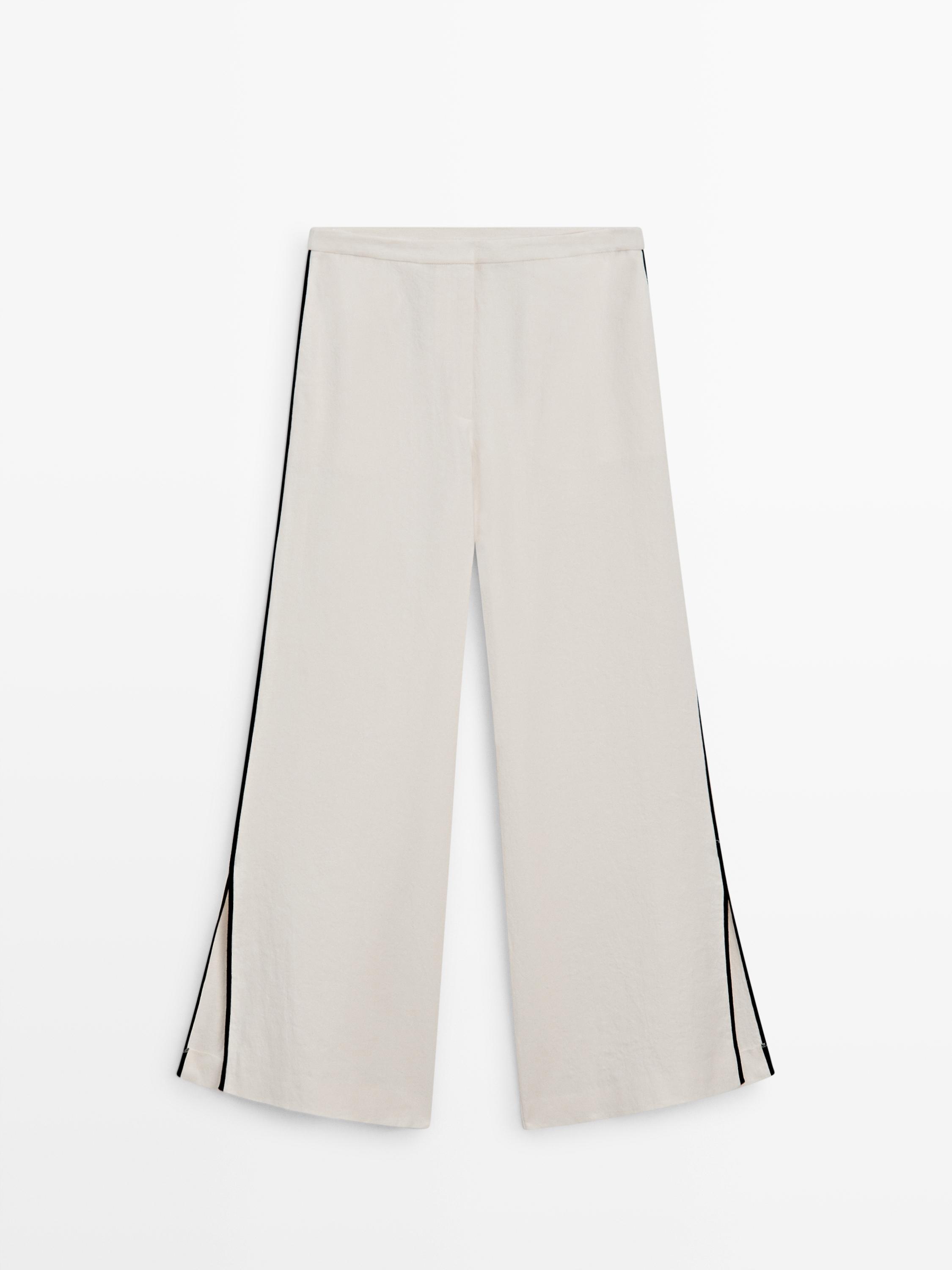 Linen trousers with contrast piping